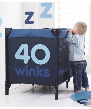 Blue travel cot with bassinette