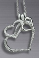 GLITTERING CHIC. . . platinum-plated triple heart crystal-set pendant