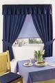 LXDirect plain-dyed tab-top curtains and tiebacks
