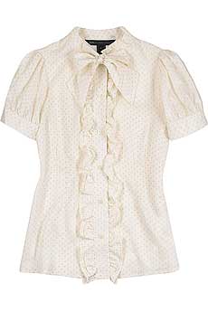 Ivory dot print silk twill blouse with a ruffle trim button fastening placket on front.
