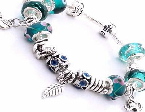 nambeads .. Pandora style silver plated charm bracelet with African Animal theme. Turquoise, Green, Blue beads... Elephants, Lion, Giraffe, Turtle, Snake and feather charms 
