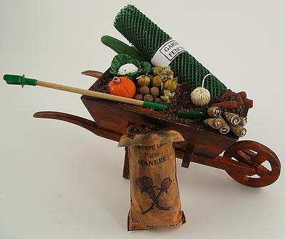This 1:12 Scale Dolls House Miniature Garden Wheel Barrow Filled with soil (will not disturb in