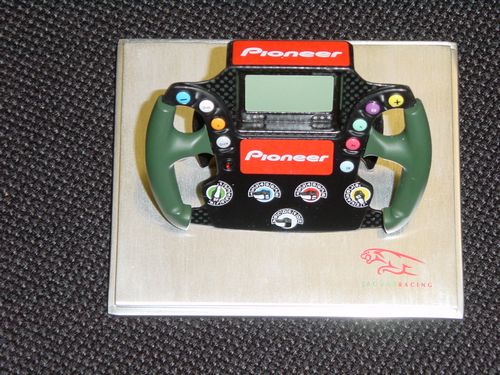 This very high quality hand built die-cast collectable model of the Jaguar R5 Steering Wheel at