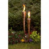 Our burnished copper-finish steel torches, each crafted from a single piece of rolled metal, simply 