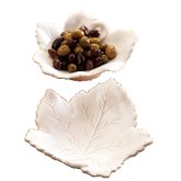 Moulded in the lovely shape of a vine leaf, these versatile white glazed earthenware dishes are hand