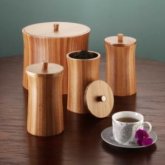 Stylishly simple shapes in warm wood, these storage containers look great on kitchen shelves and cou