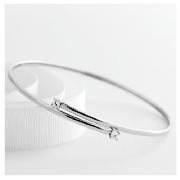 This crossover flexible bangle is made from 9ct white gold and features a cubic zirconia.