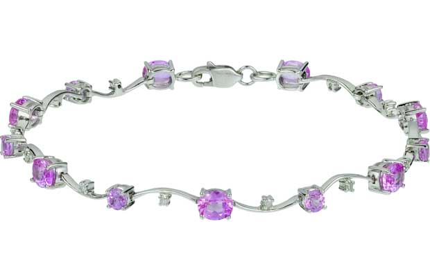 This stunning 9ct white gold bracelet designed with 10 delicately placed diamonds and precious pink sapphire stones makes a gorgeous gift for someone special. The simple