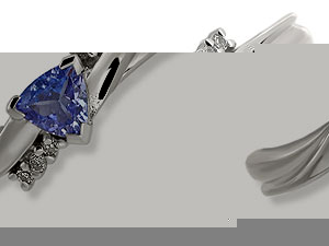 `A triangular-shaped blue tanzanite sits at the centre of this pretty 9ct white gold crossover style