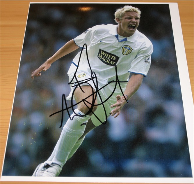 Signed in black pen by former Leeds United striker and hero Alan Smith. COA - 0420000479