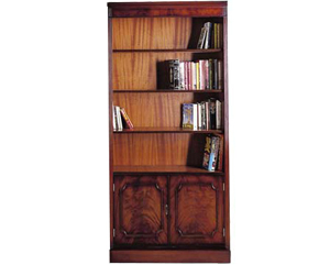Beautifully hand finished traditional bookcase cupboard. Superior curl mahogany veneer front