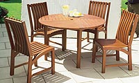 5-piece wooden set comprising 4 chairs and table.   Table:  120cms. diam, 74cms. high