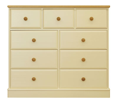 9 DRAWER EXTRA WIDE CHEST IN A DEVON CREAM PAINTED FINISH WITH SOLID OAK TOPS AND KNOBS. DOVETAILED 