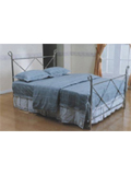 A great chrome art bed with an effective metal cross design on the headboard and footboard. The top