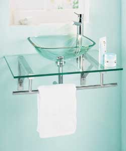 Square clear glass basin on clear glass shelf with