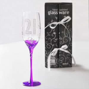 This fabulous Clear Tallulah 21st Birthday Champagne Glass would make an ideal gift for someone special who is turning 21.This clear champagne glass has a beautifully painted purple stem and base with a raised silver design that features flowers that