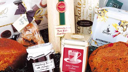 This luxury hamper contains after-dinner coffee, a tea caddy, luxury tea loaf, ginger parkin loaf, b