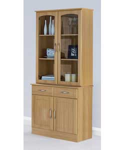 Warm oak effect display unit.2 glass doors.3 fixed internal shelves. 1 drawer on metal runners with