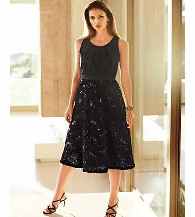 The skirt is covered in a beautiful cornelli texture giving this stunning prom a vintage twist. A simple sweetheart neck compliments the texture and softens the look. The full skirt flares out for a feminine prom style creating a fluid silhouette. Dr