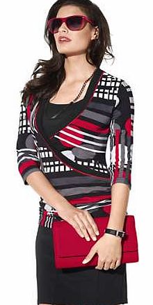 This fitted top has real finesse. The wrap-over style and side gathers create a beautiful figure. With black insert, red piping around the neckline and three-quarter length sleeves. Creation L Top Features: Wrap-over style Three-quarter length sleeve