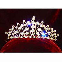 Gold finish tiara with crystal decoration. Combs attached. Decorated area measures approximately 14 