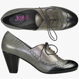A fashionable court shoe from Jones Bootmaker. Features wing-tip brogue detailing with lace up, two 