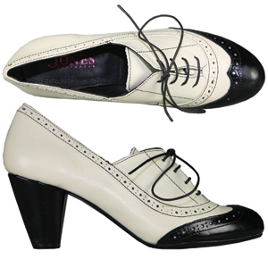 A high cut shoe from Jones Bootmaker. With wing tip brogue detail and lace up, this Victorian style 