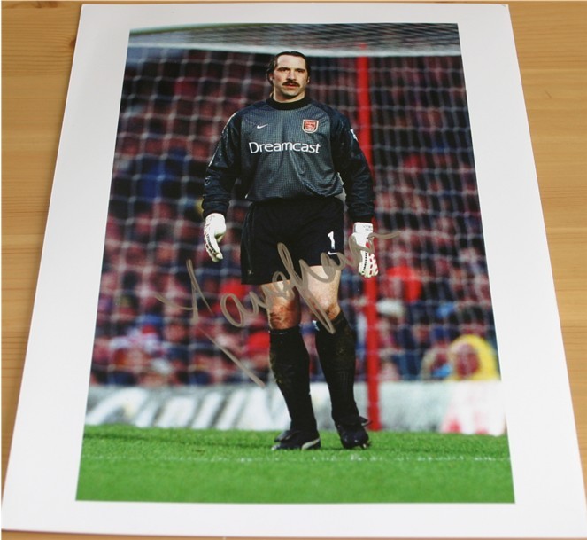 Signed in silver pen by the ex-Arsenal and England keeper. COA - 0420000411