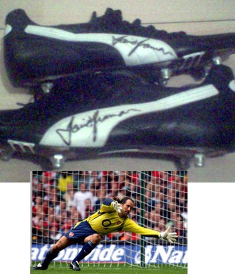 This is a black and white puma studded football boot which was worn by Arsenal keeper David Seaman