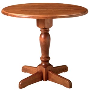 Simple, classic pedestal table in chestnut stained beech with drop leaf extension.