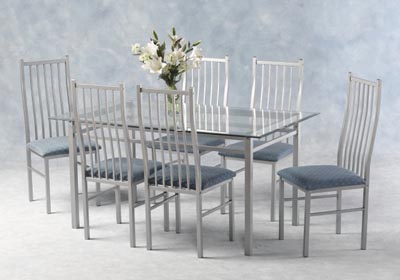 RECTANGULAR GLASS TABLE AND SIX UPHOLSTERED CHAIRS.THIS STYLISH COMBINATION OF SILVER AND GLASS IS