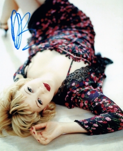 Signed in blue pen by Drew Barrymore. Certificate Of Authenticity no. 0120000221