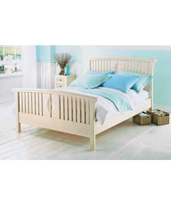 White pine bedstead in modern sleigh design.Latex laminated sprung beech slats, designed to work in