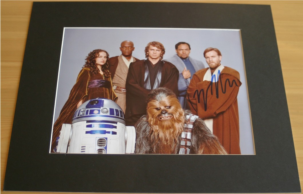 Quality colour photograph of the Star Wars cast which has been signed in blue pen by Ewan McGregor