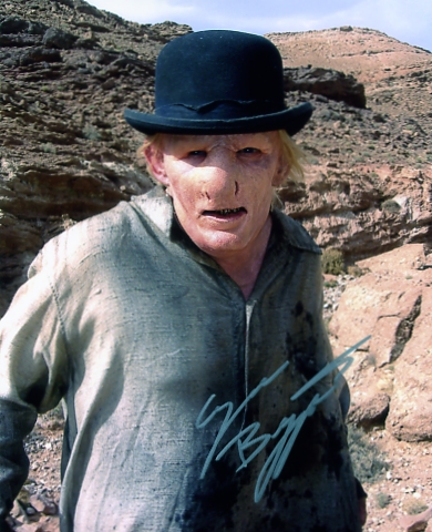 A colour photograph of Ezra Buzzington in character as Goggle - signed in silver pen - from the