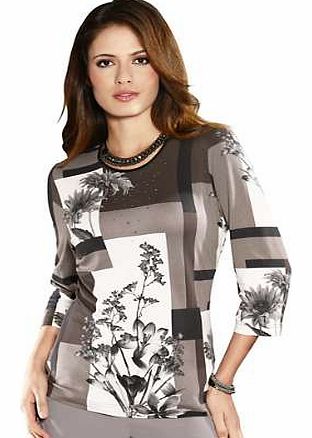 This top has an abstract floral print which is highlighted with sequins. With a rounded neckline with elegant black piping and three-quarter length sleeves. Fair Lady Top Features: Round neck Three-quarter length sleeves Flattering fit Washable 93% V