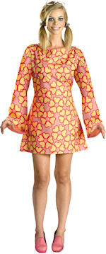 Adult Official 60s Barbie Deluxe Costume includes dress, sunglasses, hair ties and arm tag.