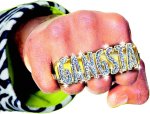 Knuckle duster style ring that fits over index, middle and ring fingers.
