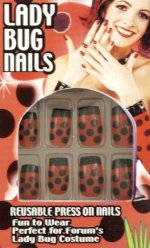 Reusable press on nails with a black dots on red print.