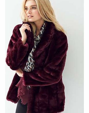 Three-quarter length faux fur coat, fully lined in satin. Dry clean. 80 Acrylic, 20 Polyester. Linin