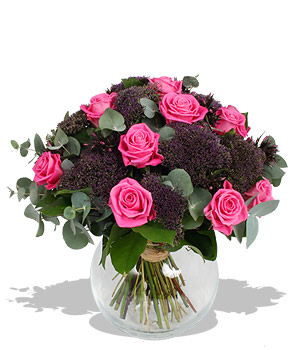 First blush Balmy pink roses flirt brilliantly with clusters of purple blossoms and dusky eucalyptus