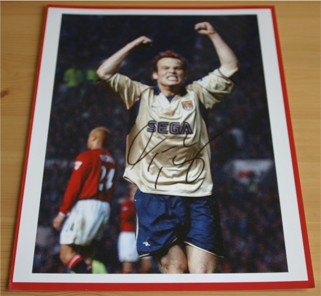 Signed in black pen by the Arsenal and Sweden midfield star. COA - 0420000416