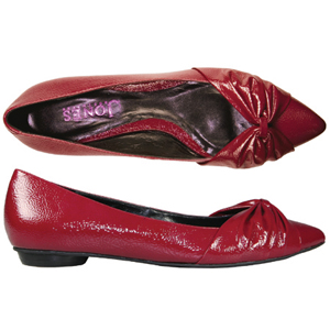 A pointed toe pump from Jones Bootmaker. Features Patent uppers, gathered bow detail to the toe and 