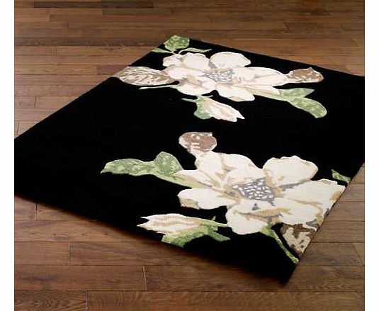 Dramatic floral design on a black background, a real statement rug. 100% Wool Size: 60 x 120 cm (24 x 48 ins), 80 x 150 cm (32 x 60 ins), 120 x 170 cm (48 x 68 ins), 160 x 230 cm (64 x 92 ins)