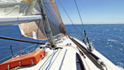Try your hand at sailing, or just relax on board.