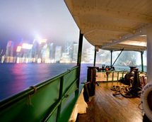 Enjoy open-bar hospitality and spectacular views of illuminated Hong Kong as you gently cruise aboar
