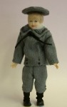 By Heidi Ott, this lovely little Victorian boy figure is dressed in a blue sailor