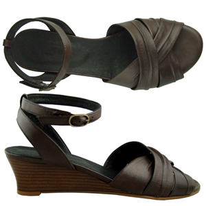 A comfortable sandal from Jones Bootmaker. Features interwoven straps, low wedge heel and soft leath