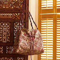 A stylish tapestry bag with an exotic design inspired by the textiles of Mughal India. 100% wool