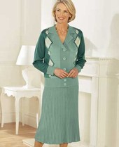 Buttoned through jacket with attractive design. Fully pleated skirt with all round elasticated waist
